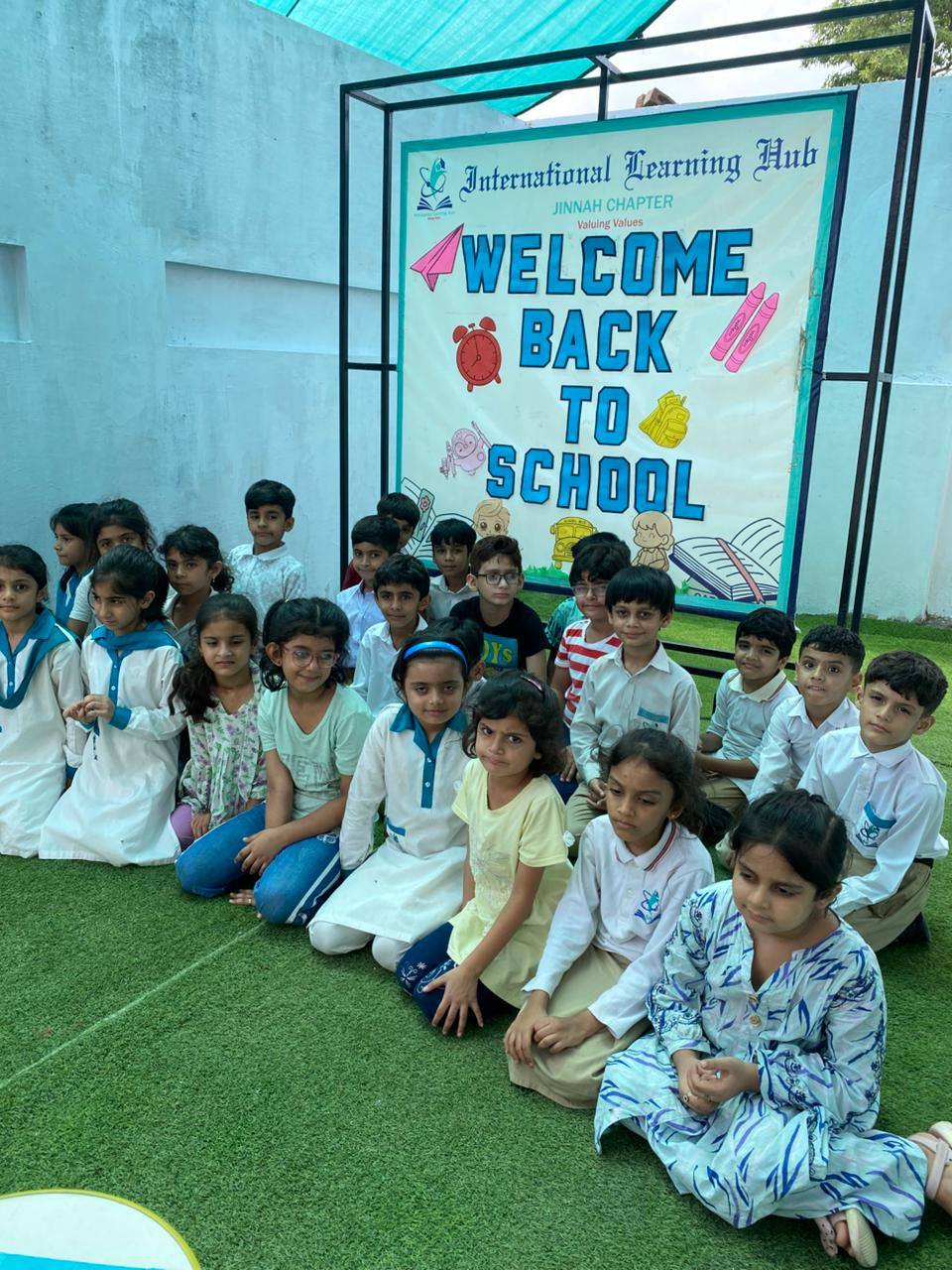 May be an image of 12 people and text that says "Internafional Tearning Hub JINNAH CHAPTER WELCOME Valuing Values BACK TO SCHOOL Ye"